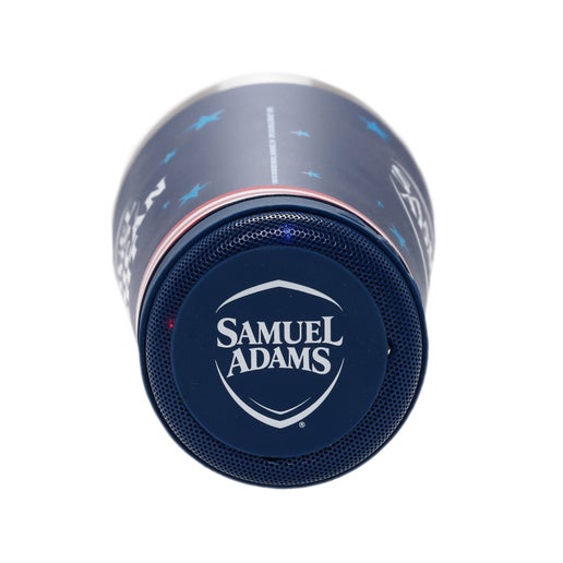 A navy Samuel Adams American Light metal tumbler with a speaker on the bottom.