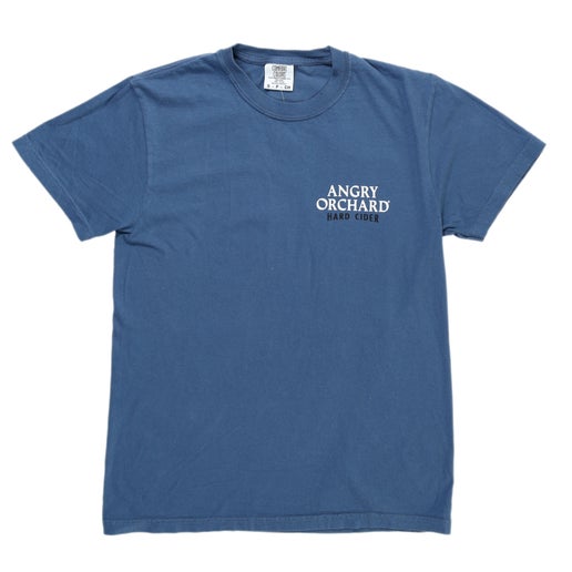 Front of tee is solid blue and displays writing "Angry Orchard Hard Cider" on left side of chest.