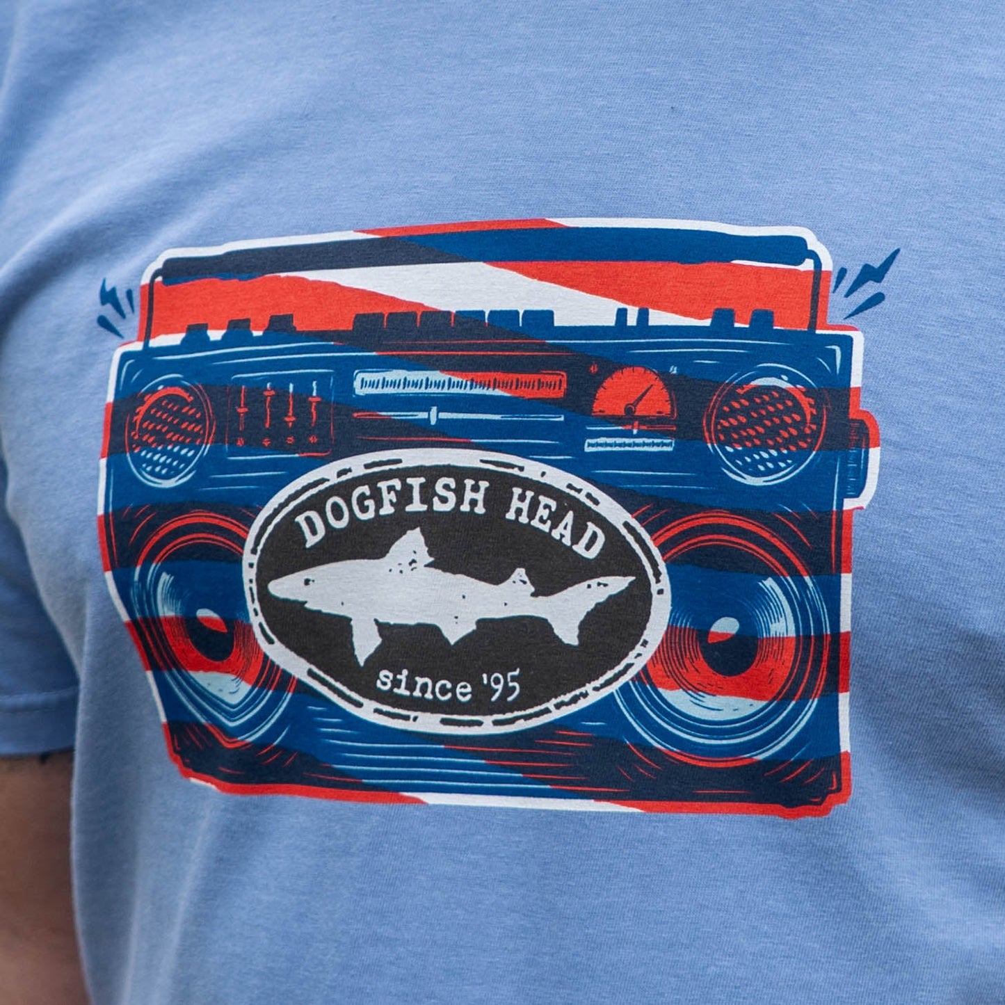 Blue t-shirt with a graphic design of a radio and 'Dogfish Head' logo on a blue background