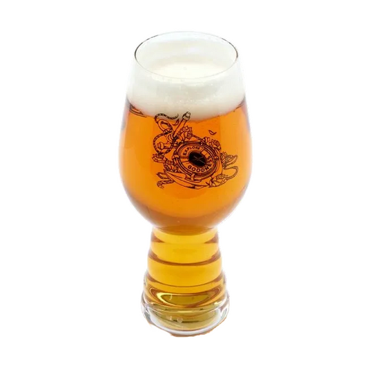 A 19oz glass filled with beer featuring black imagery of underwater designs on the front with writing "Explore Goodness" on it. The other side of the glass features a black Dogfish Head shark and shield logo.