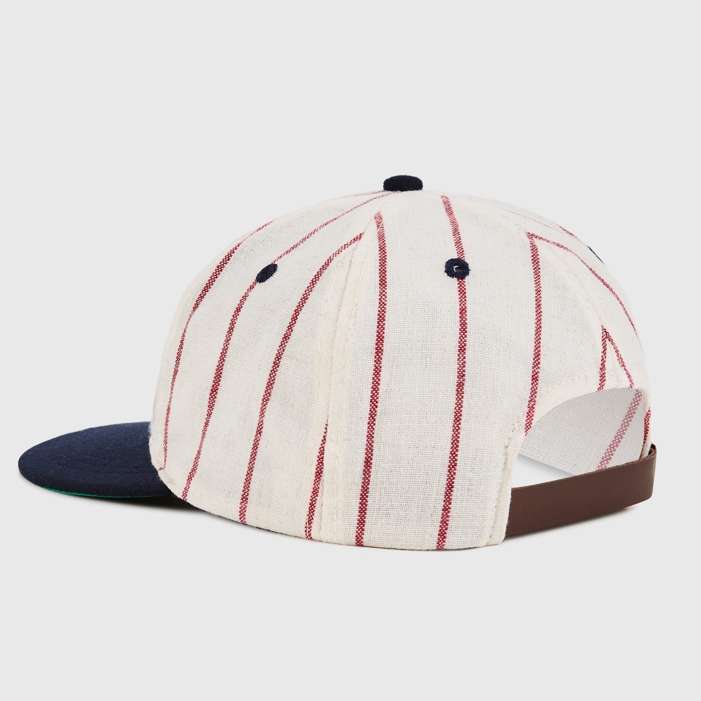 Baseball cap with red and white striped pattern on a light gray background