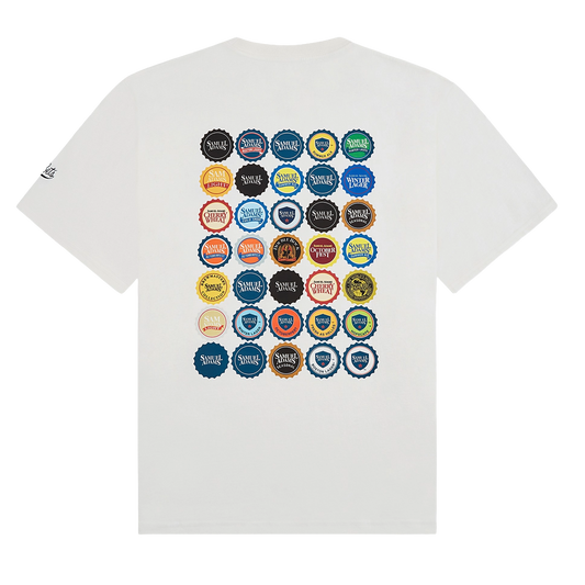 White t-shirt with colorful bottle cap designs on a white background