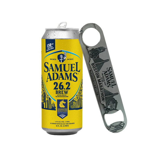 Samuel Adams Boston Marathon paddle bottle opener displayed beside a Samuel Adams 26.2 Brew can, highlighting engraved Boston skyline artwork and durable stainless steel design.