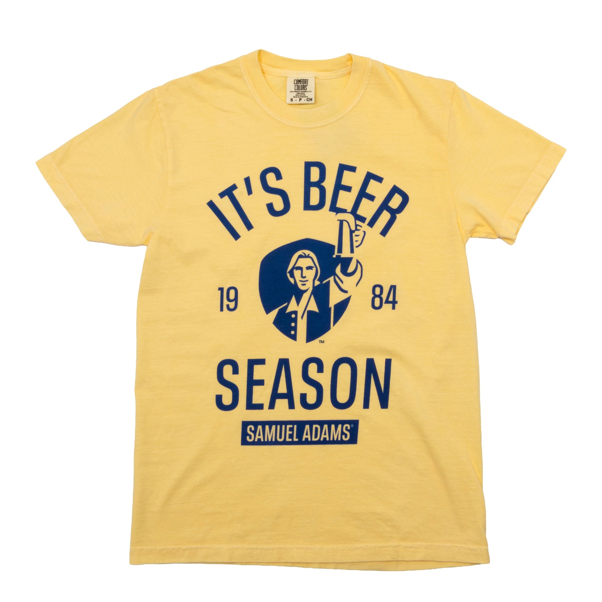 Samuel Adams yellow ‘It’s Beer Season’ t-shirt with navy logo graphic, 1984 print, and classic Samuel Adams hoist design on soft cotton tee