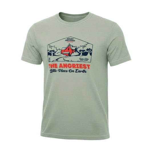 A sage green crewneck t-shirt featuring a vintage-style graphic print on the front with a mountain scene, a red tent, and the text 'THE ANGRIEST Little Place On Earth' in red and navy blue.