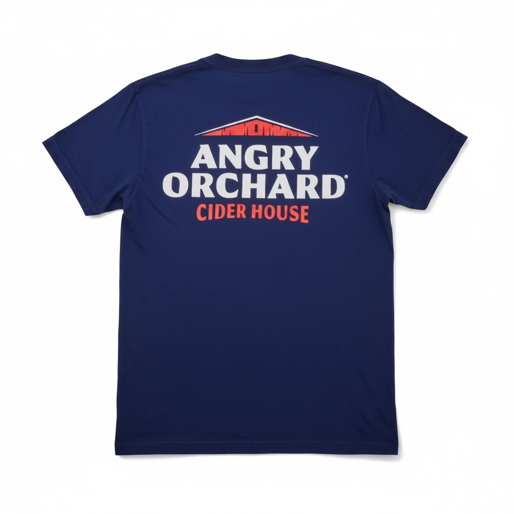 The back view of a blue crewneck tee shirt. The Angry Orchard logo is written in white and "Cider House" is written in red. The top of a red barn is featured above the writing. The shirt is laid flat against a white background.