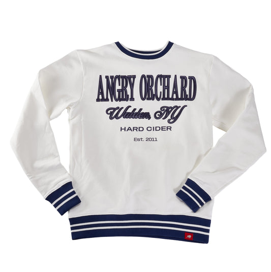 Angry Orchard White Walden Crew Sweatshirt—front view showing navy embroidered text “ANGRY ORCHARD,” “Walden, NY,” “HARD CIDER,” and “Est. 2011,” with ribbed crewneck, cuffs, and hem featuring navy stripe accents; premium hard cider apparel.