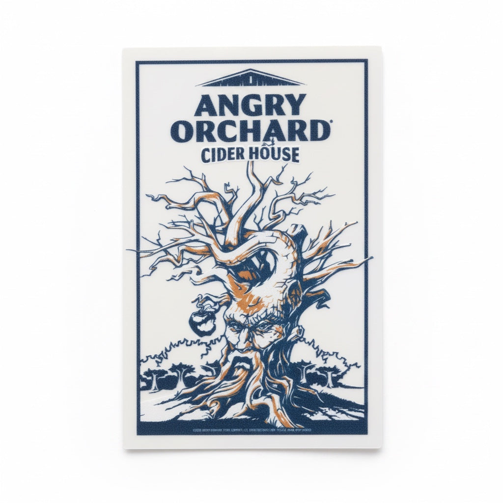 A rectangle sticker with Angry Orchard Cider House written at the top. A leafless, branchy tree with a face and large roots covers the rest of the sticker. 