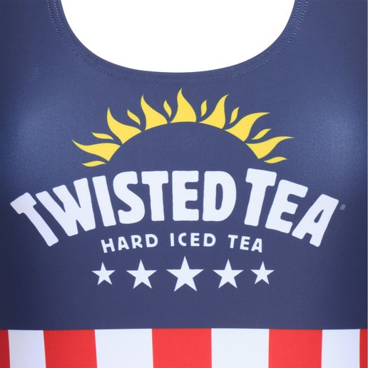 Close-up of the upper chest area of an American flag-themed swimsuit. The dark blue fabric features a white "TWISTED TEA HARD ICED TEA" logo with a yellow sunburst design above it and five white stars below. Below this section, red and white vertical stripes are visible.