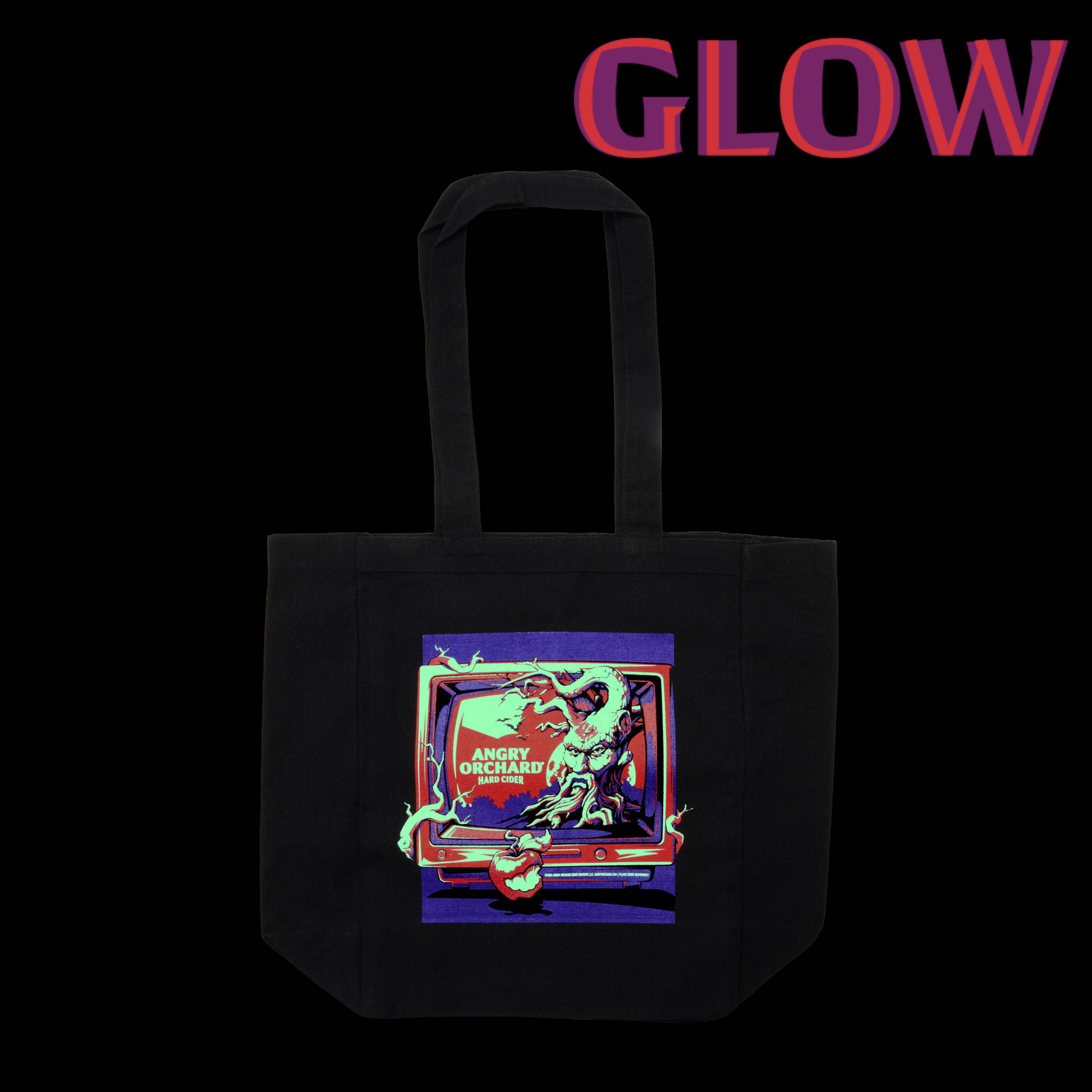 A black canvas tote bag with a colorful graphic print on the front, displayed against a solid black background with the word 'GLOW' in red and purple text at the top.