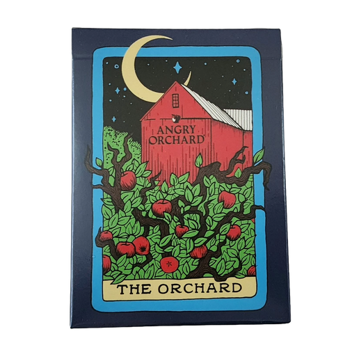 The box and outside of these playing cards display a design of a moonlit orchard on a tarot card. The "name" on the tarot card is "The Orchard".