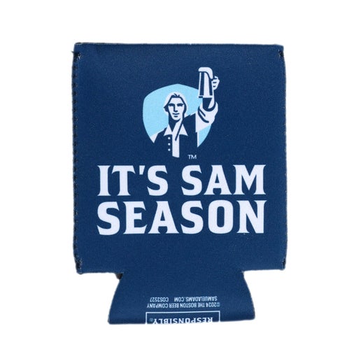 A blue 12-ounce can cooler with the Samuel Adams Hoist logo in white, navy, and light blue over text that reads "It's Sam Season".
