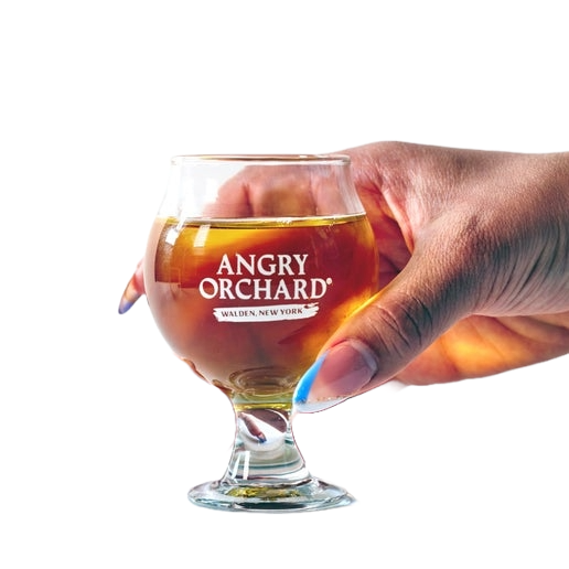 This Belgian tasting glass has the writing "Angry Orchard" and underneath it, "Walden, New York". 