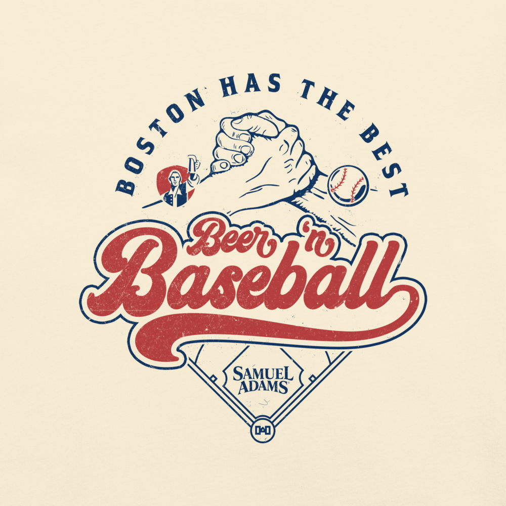 Close‑up of Samuel Adams cream T‑shirt graphic showing retro ‘Boston Has the Best Beer ’n Baseball’ lettering, handshake illustration, baseball icon, and home plate design.