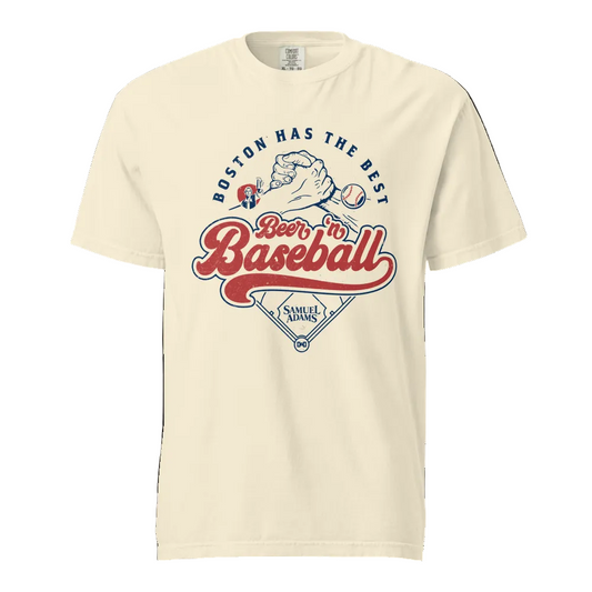 Cream Samuel Adams graphic T‑shirt  showing retro ‘Boston Has the Best Beer ’n Baseball’ lettering, handshake illustration, baseball icon, and home plate design.