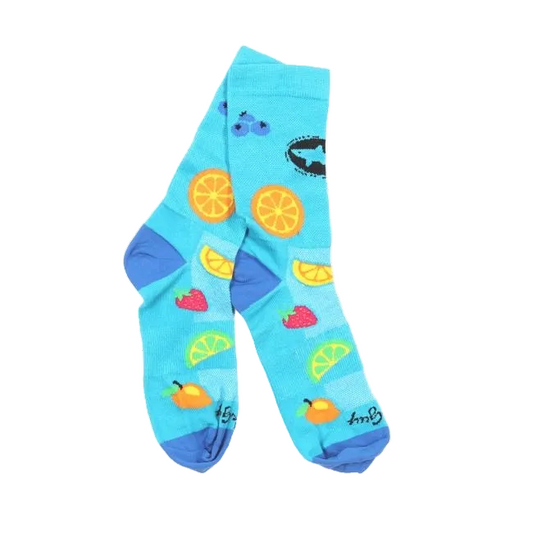 Light blue socks with a darker blue heel and toes. The socks feature various fruits on the socks including: a strawberry, blueberries, orange, lime, lemon, and the Dogfish Head shark and shield logo.