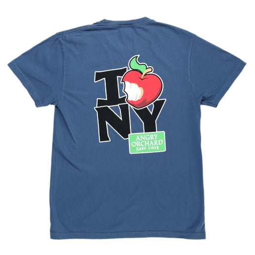 Back of blue tee displays I apple NY. The apple used is the iconic Angry Orchard red bitten apple but is shaped like a heart; to say I heart NY. "Angry Orchard Hard Cider" writing is also featured.