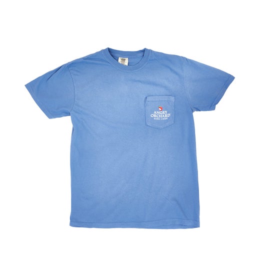 Front of blue tee features a pocket with the Angry Orchard logo which includes the bitten red apple and writing "Angry Orchard Hard Cider" underneath.