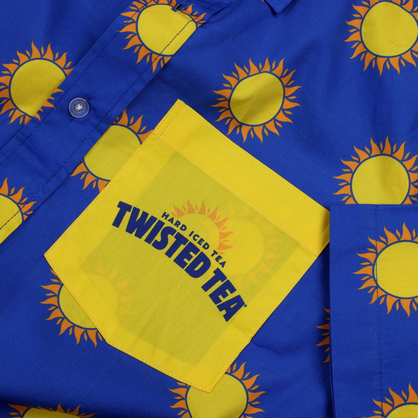 Blue shirt with sun patterns and Twisted Tea branding on a matching background
