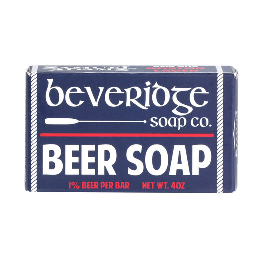 Our Beer soap made with Samuel Adams Boston Lager has a clean men's cologne scent. The soap is packaged in a navy blue box with white text and white and red details.