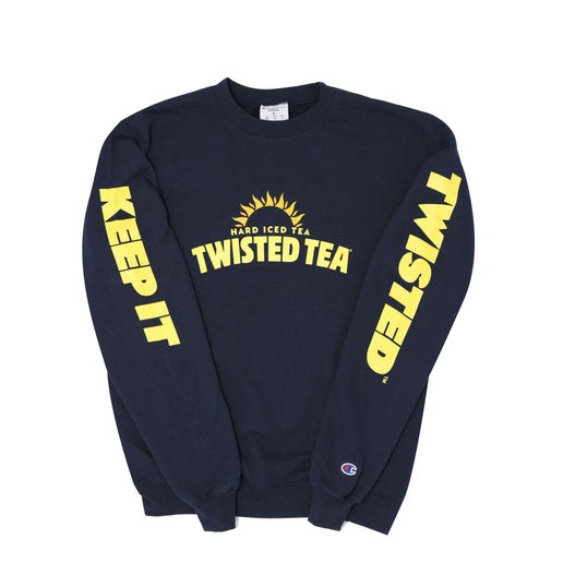 A dark blue Champion brand crewneck sweatshirt with yellow "TWISTED TEA HARD ICED TEA" text and a sunburst logo across the chest. The left sleeve reads "KEEP IT" vertically in yellow, and the right sleeve reads "TWISTED" vertically in yellow. A small Champion logo is visible on the left wrist.