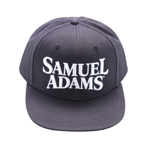 Hat features an adjustable back, navy blue exterior, red interior, and thick, risen Samuel Adams embroidery in white.