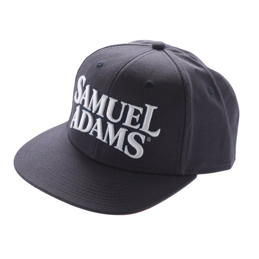 Hat features an adjustable back, navy blue exterior, red interior, and thick, risen Samuel Adams embroidery in white.