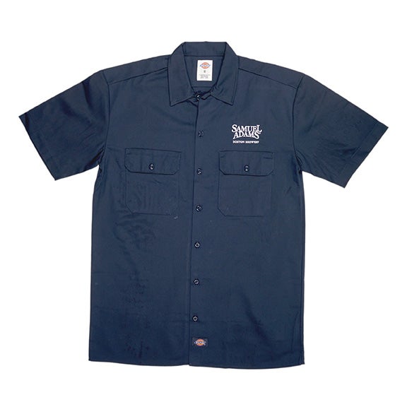 A navy Dickies button-up work shirt with a pocket on each side of the chest. Also features the Samuel Adams logo embroidered over the left side pocket.
