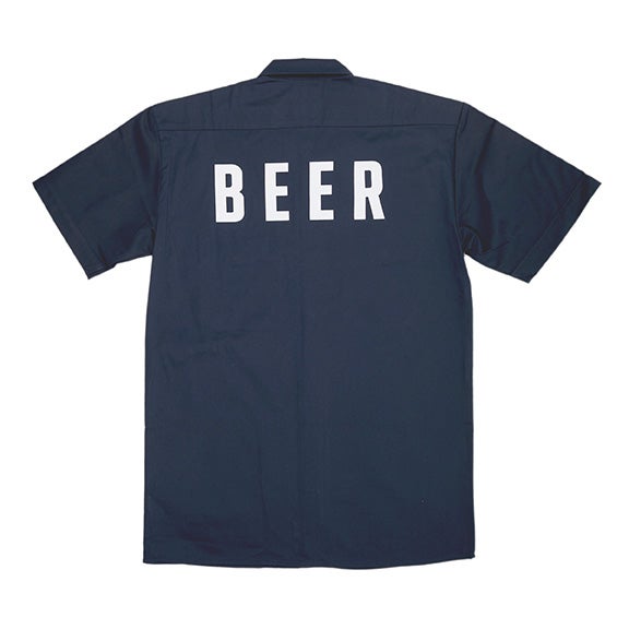 Back side of the navy Dickies work shirt, with the word "Beer" across the back.