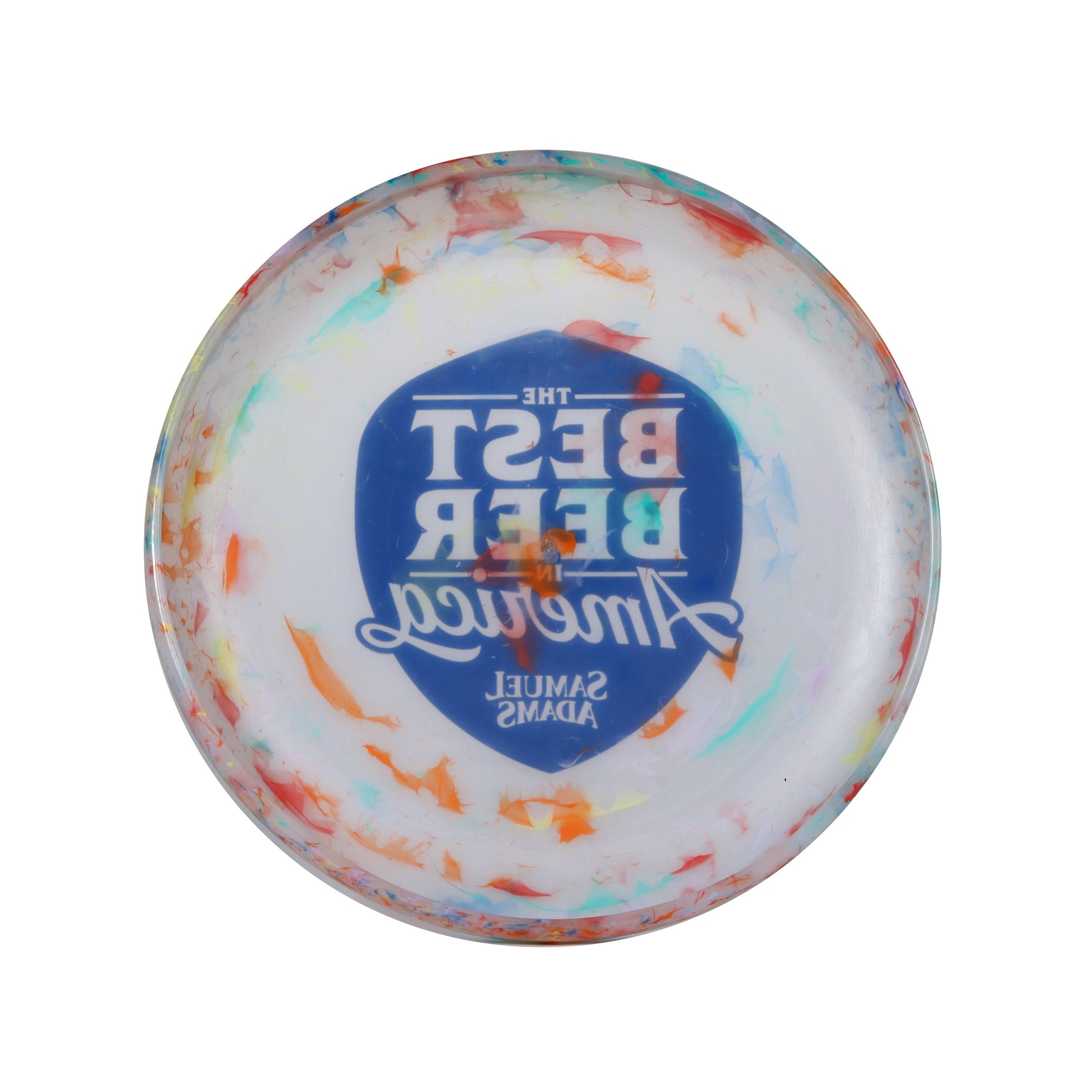 A frisbee with a white base but some multicolor accents, featuring a navy shield on the front with the phrase "The best beer in America" in it. Also features the Sam Adams logo.