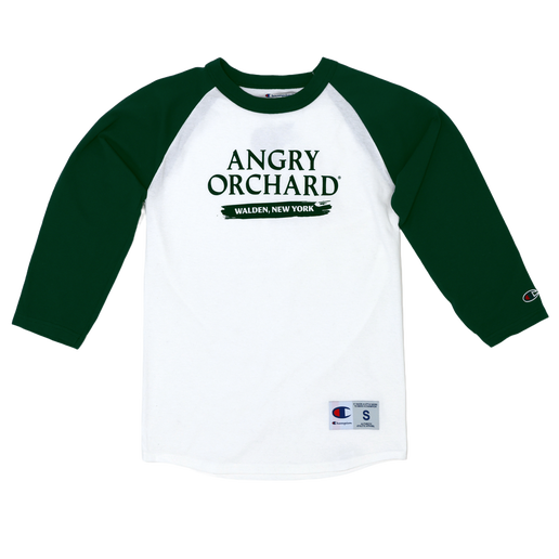 This baseball tee has a white base and green sleeves. The front of the tee displays writing "Angry Orchard" and "Walden, New York" directly under. Champion logo is displayed on bottom of left sleeve and bottom left of tee. 