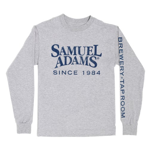 A classic heather grey long sleeve tee with the Samuel Adams logo on the front in navy blue that says "since 1984" under it and "Brewery - Taproom" on the left sleeve.