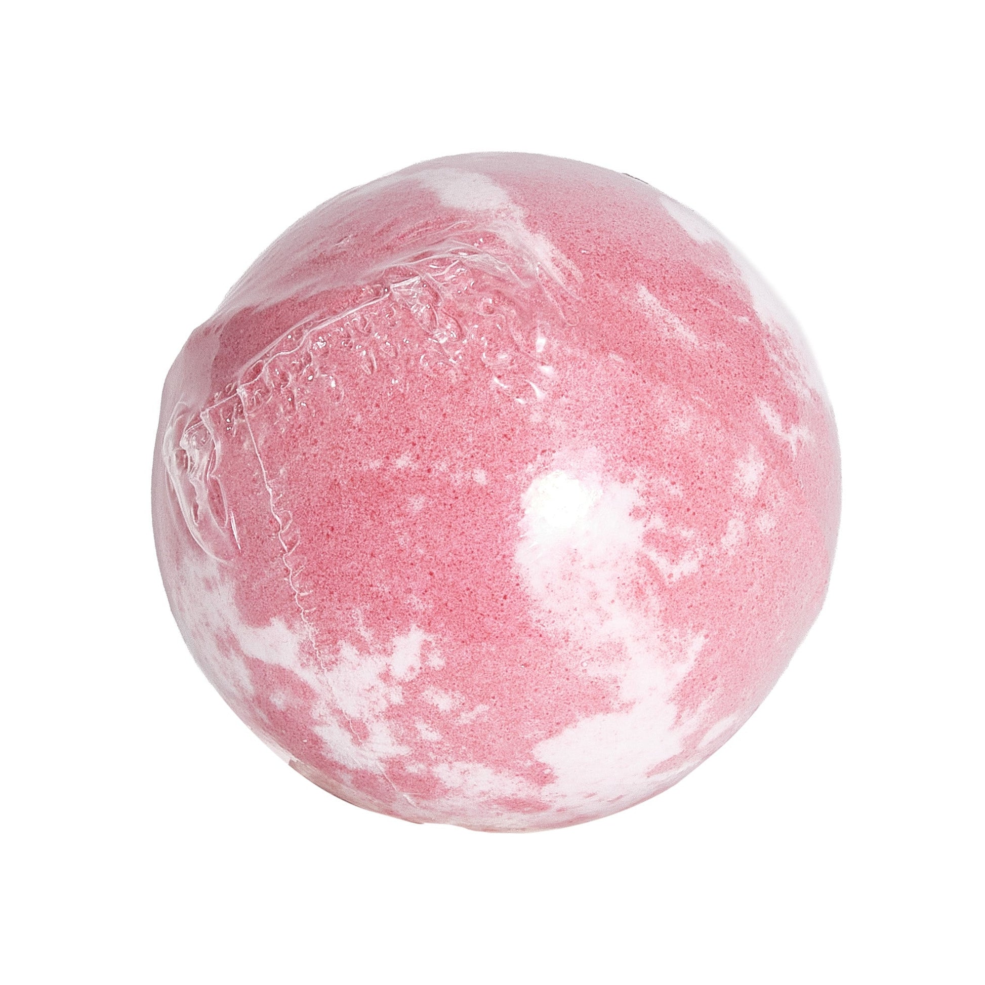 A round pink bath bomb with white marbled patches, shown wrapped in clear plastic. The surface has a slightly textured, powdery appearance, and the wrapping seam is visible across one side.