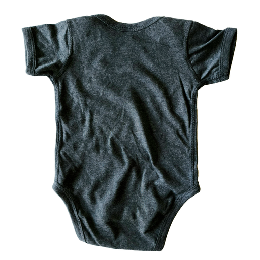Black of onesie is solid black. 
