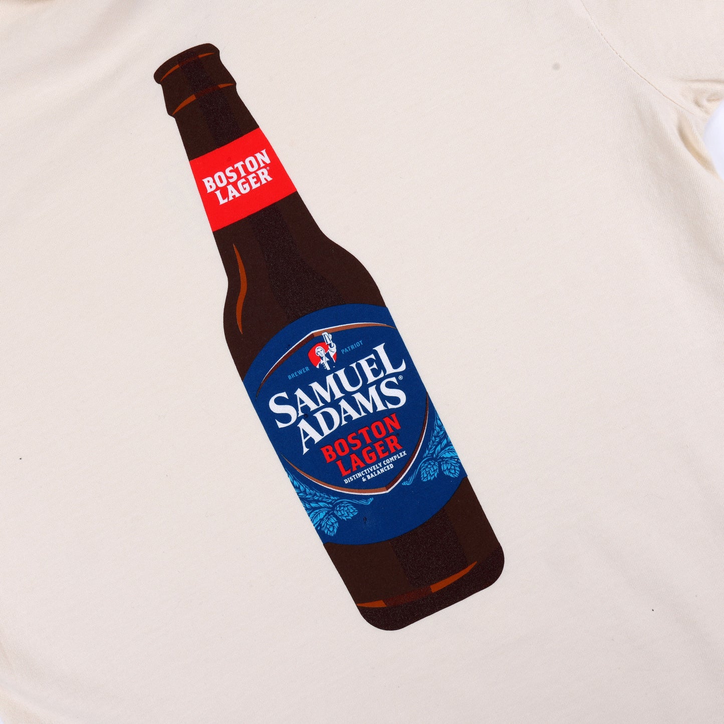 Back view of the shirt with a large graphic of a Samuel Adams Boston Lager bottle printed in full color.