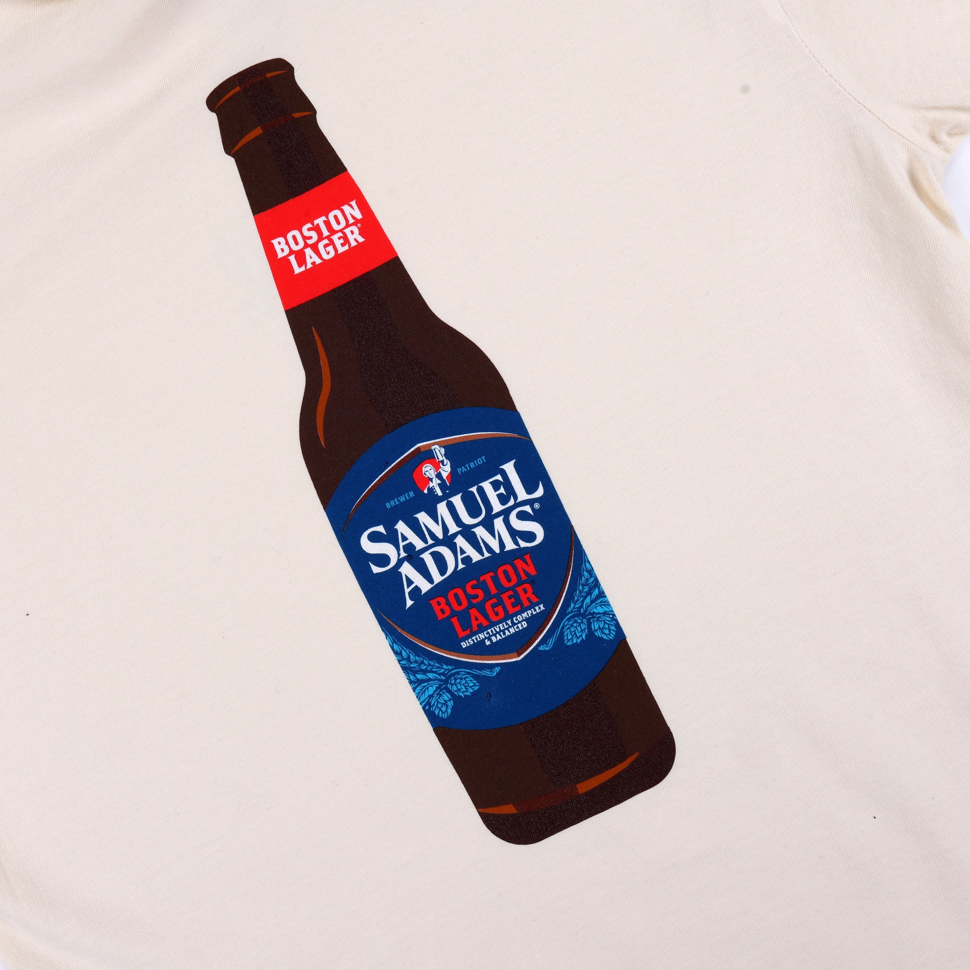 Back view of the shirt with a large graphic of a Samuel Adams Boston Lager bottle printed in full color.