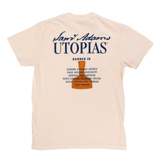 Close-up of the back graphic displaying the bold Utopias logo, copper bottle, and banned state list in navy and orange ink.