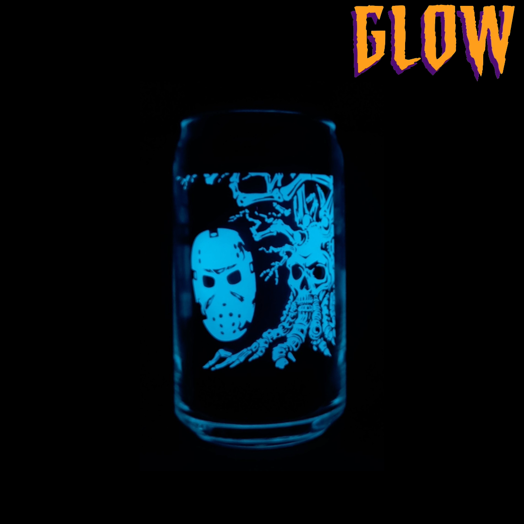 Glowing glass with a design of a mask and skeleton on a black background with 'GLOW' text.