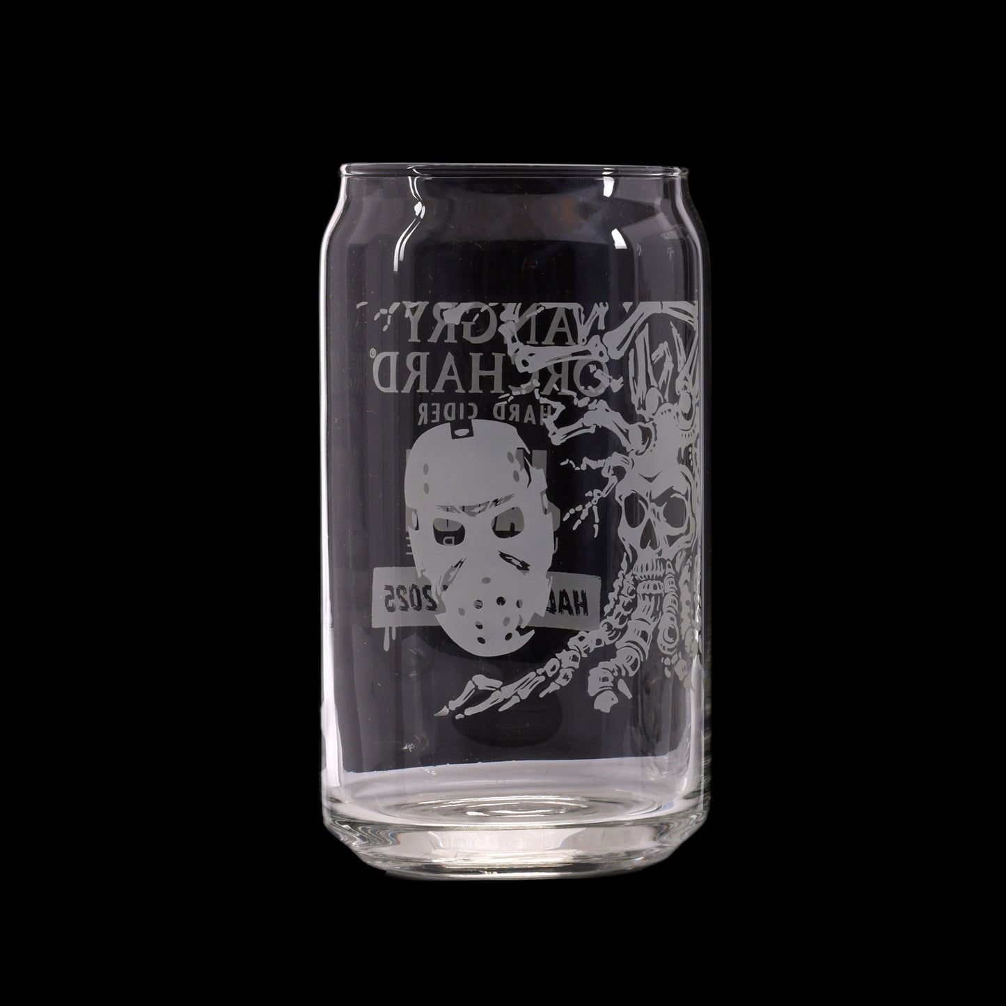 Clear glass can with black label featuring a white mask and skeleton design on a white background
