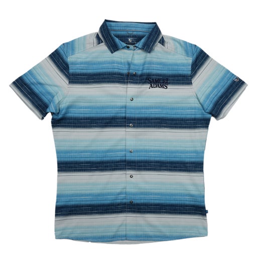 Front and back views of a Samuel Adams KUHL Blue Stripe Ikonik Persuadr Short Sleeve Button Up, featuring horizontal blue-toned stripes, snap buttons, and embroidered Samuel Adams logo on the left chest.