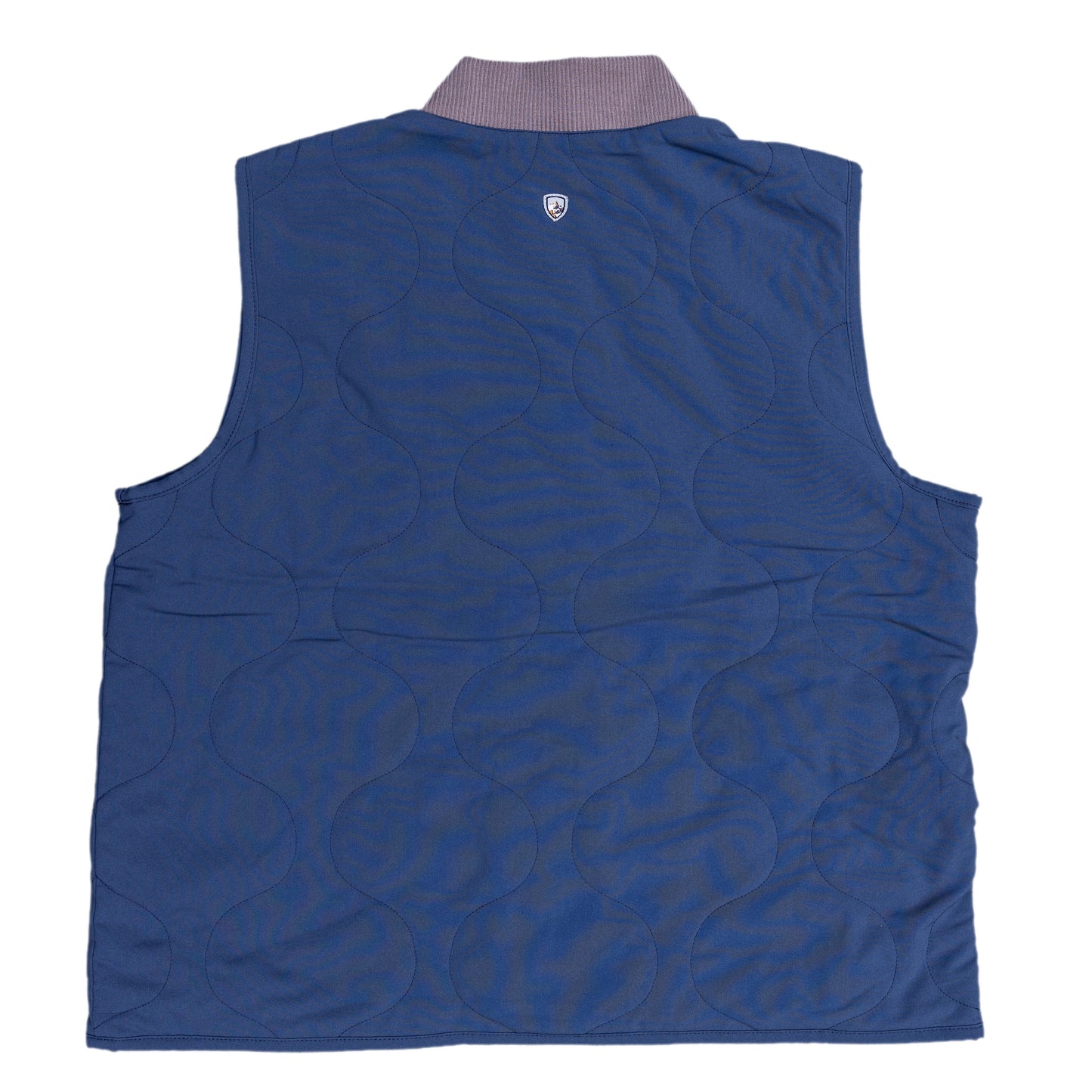 Back view of the vest is solid blue with the quilted design and a small Kuhl logo featured under the collar.