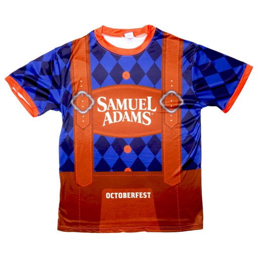 Front view of lederhosen tee. Tee is blue checkered with orange lining around the neck and sleeves. Features imagery of suspenders and large writing "Samuel Adams" in the center. "Octoberfest" written down by the waist.