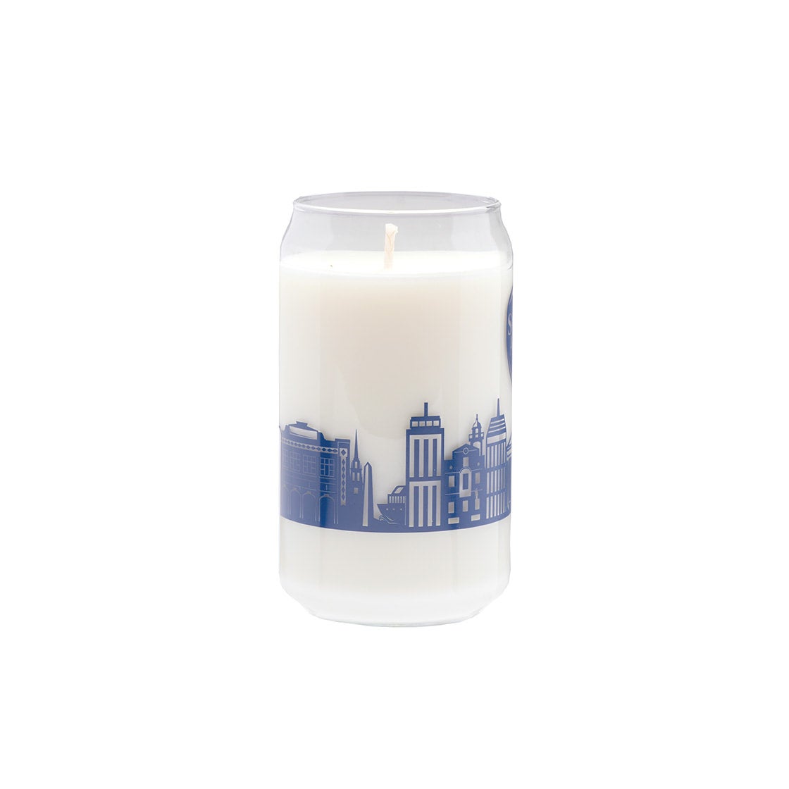 This can-shaped glass has a navy illustration of the Boston skyline around the outside of it with the Samuel Adams classic shield logo above it. The glass is filled with a white wax candle.