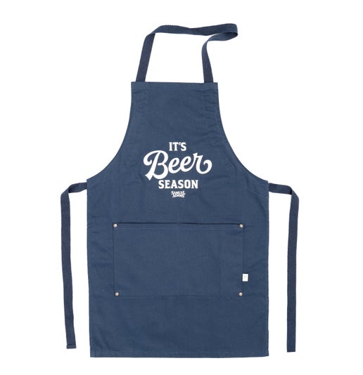 A navy apron with a large front pocket under a slogan that reads "It's Beer Season"
