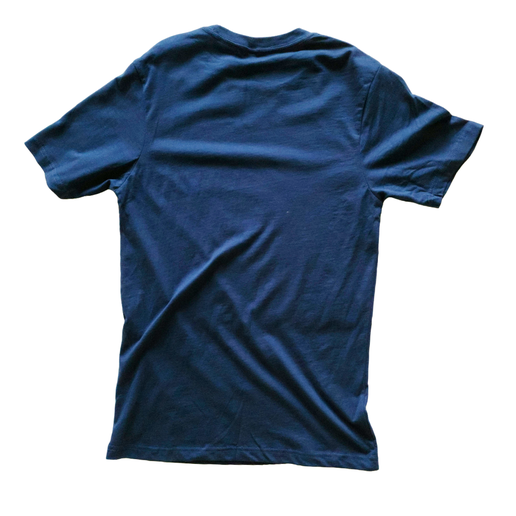 This is a navy tee with a light blue emblem centered to the tee. In the center is an image of the Angry Orchard tree trunk with a face on it. Around the image is writing including, "Angry Orchard Cider House", "HV", and "NY". The back of the tee is solid navy.