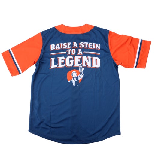 Navy jersey with orange sleeves and neck lining. Back view which features writing "Raise a Stein to a LEGEND" and Sam Adams hoist logo.