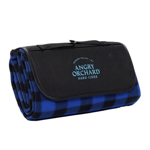 This blue plaid blanket has an area that holds the Velcro to close the blanket up has the writing "Hudson Valley, NY" and under it "Angry Orchard Hard Cider". 