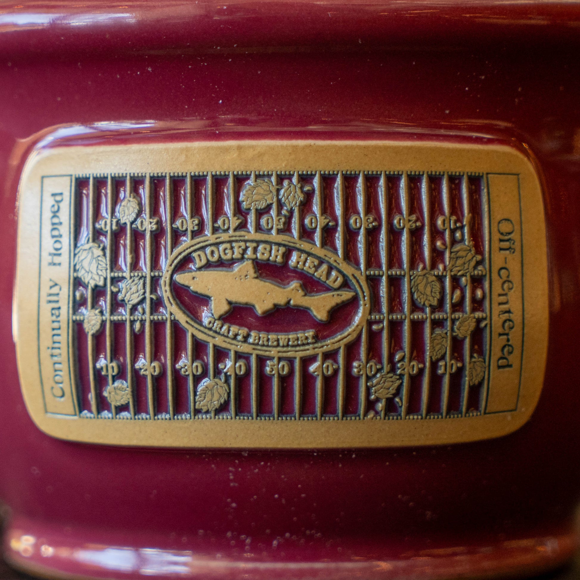 Dogfish Head Craft Brewery logo on a red background