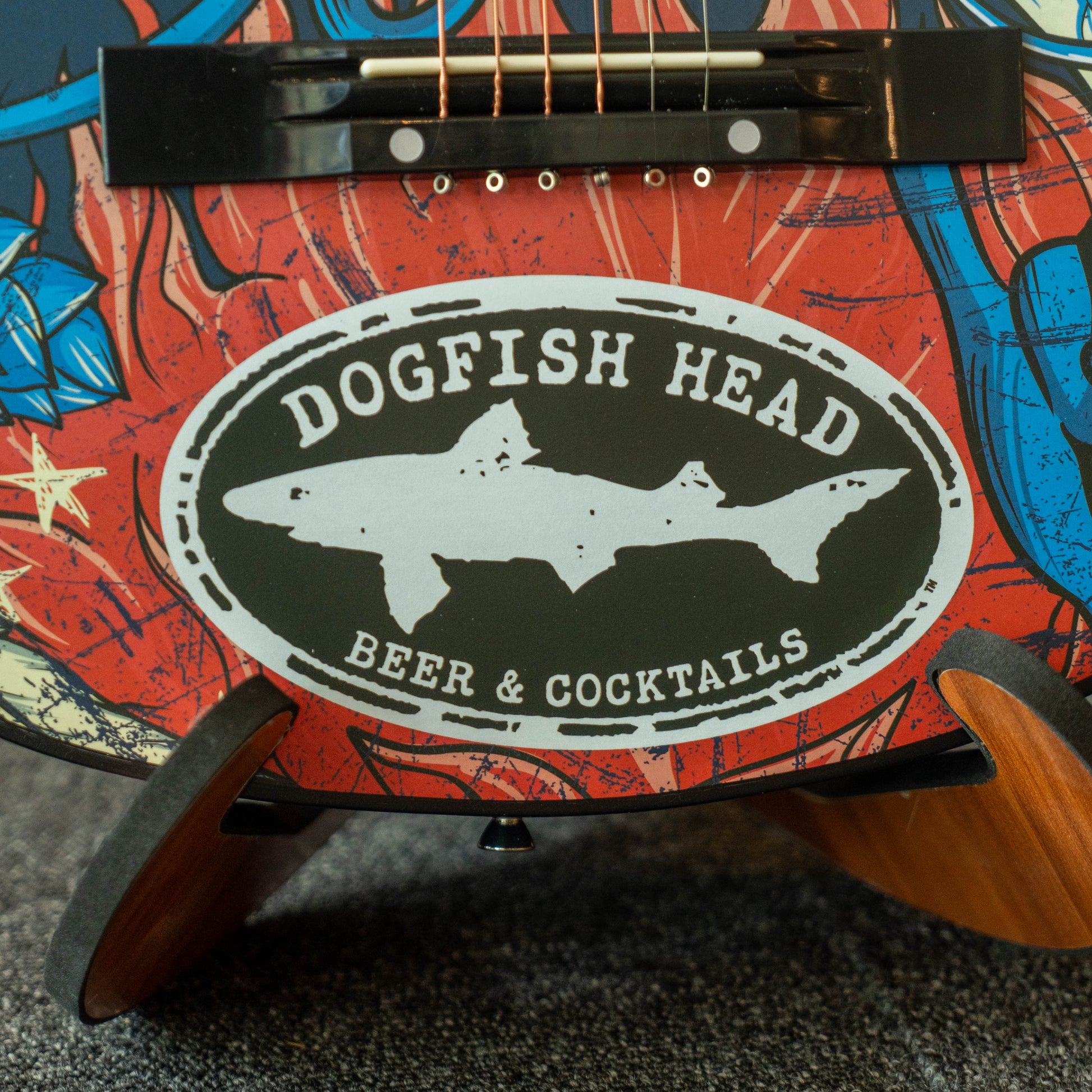 Dogfish Head logo on a guitar with a colorful design