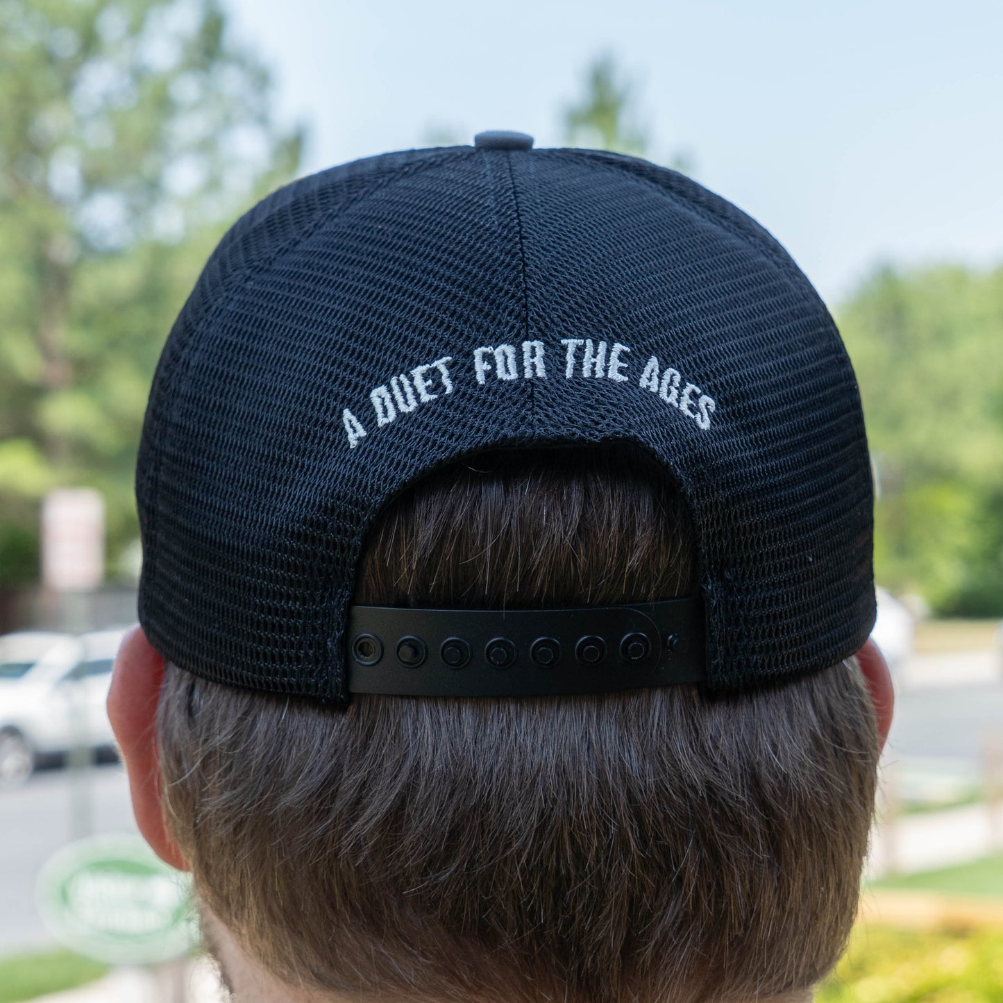Dogfish Head x Rolling Stone trucker hat with black mesh back and snapback with 'A Duet For The Ages' text on the back